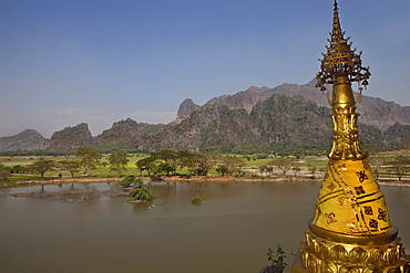 View from the Kyauk Ka Lat Pagoda on a rock, golden stupa in front of karst mountains, Kayin State, Myanmar, Birma, Asia