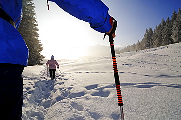 People hiking on winter hiking trail, Reit im Winkl, Chiemgau, Upper Bavaria, Bavaria, Germany, Europe