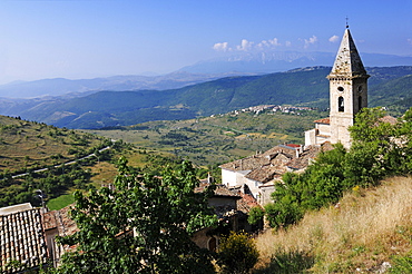 Sunlit church at mountain village, Rocca Calascio, Gran Sasso National Park, Abruzzi, Italy, Europe