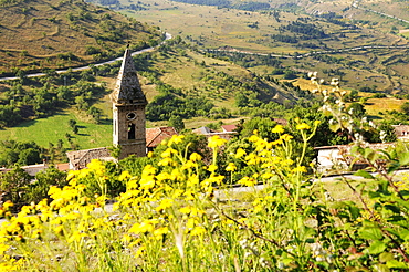 Sunlit church at mountain village, Rocca Calascio, Gran Sasso National Park, Abruzzi, Italy, Europe