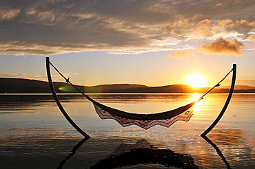 Hammock on the beach of Ekies Hotel, Vourvouru, Sithonia, Chalkidiki, Greece