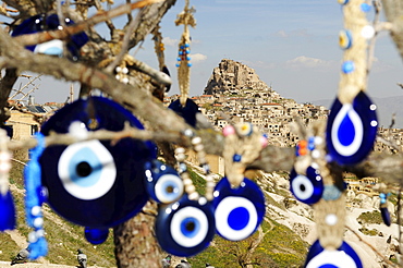 Protection amulets against evil eye in front of the mountain city Uchisar, Goereme, Cappadocia, Turkey