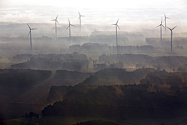 Aerial view of a wind farm in the early morning mist, Lower Saxony, Northern Germany