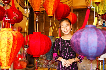 Woman inside a lampion store, Hoi An, Annma, Vietnam