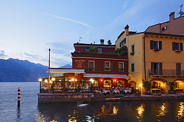 Restaurant, illuminated, Malcesine, Lake Garda, Veneto, Italy