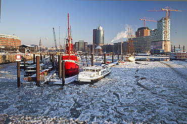 Fire ship in front of HTC Hanseatic Trade Center and Elbphilharmonie in winter, the Free and Hanseatic City of Hamburg, Germany, Europe