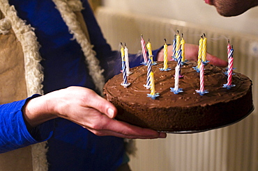 Woman holding a birthday cake