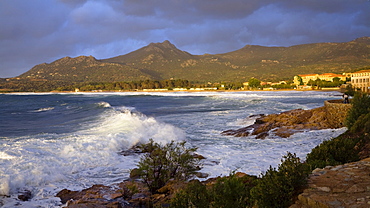 Sunset and surf in Algajola Bay, North-west coast, Balagne region, Corsica, France, Europe