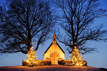 Illuminated chapel with two illuminated Christmas trees, lake Chiemsee, Chiemgau, Upper Bavaria, Bavaria, Germany, Europe