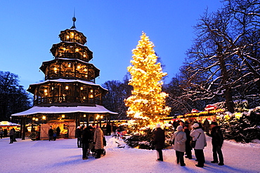 People at christmas market in the evening, Chinesischer Turm, Englischer Garten, Munich, Upper Bavaria, Bavaria, Germany, Europe