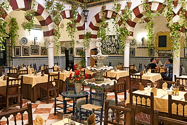 Courtyard interior of a restaurant in the old quarter, Cordoba, Spain