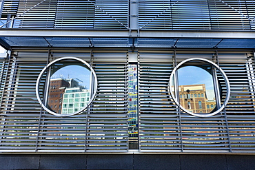 Reflection in round windows, Media Harbour, Duesseldorf, Duesseldorf, North Rhine-Westphalia, Germany, Europe