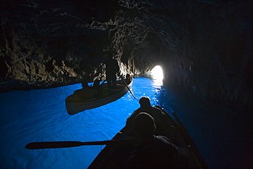 Rowing boats inside the Blue Grotto, Capri, Campania, Italy