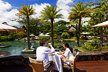 People on the terrace of the restaurant, Shanti Maurice Resort, Souillac, Mauritius, Africa