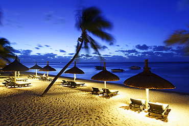 Illuminated beach of Beachcomber Hotel Paradis & Golf Club in the evening, Mauritius, Africa