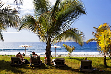 People and palm trees on the beach at Hotel Saint Alexis, Saint Gilles les Bains, La Reunion, Indian Ocean