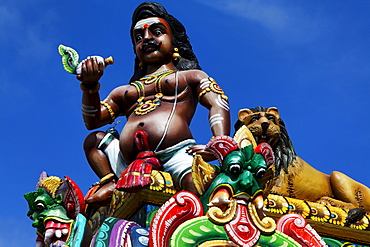 Figure on Indian temple in Tevelave, est coast of La Reunion, Indian Ocean