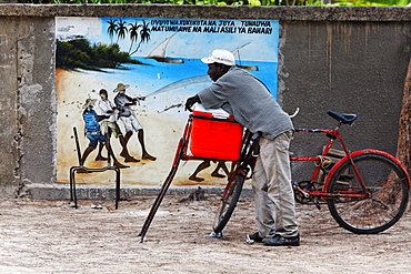 Man in front of the school gate in Jambiani, Zanzibar, Tanzania, Africa