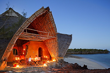 People in front of the Chumbe Island Coral Park Lodge in the evening, Restaurant in the Visitor Center, Chumbe Island, Zanzibar, Tanzania, Africa