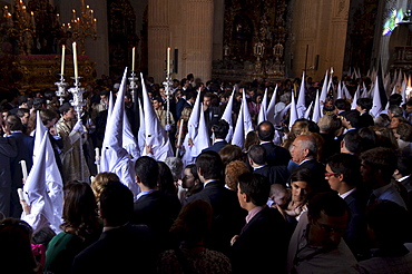 Nazarenos of the brotherhood La Borriquita at the church El Salvador on Palm Sunday, Semana Santa, Sevilla, Andalusia, Spain, Europe