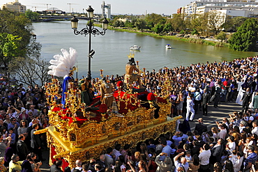 Crowd and brotherhood La Estrella during procession on Palm Sunday, Semana Santa, Triana, Sevilla, Andalusia, Spain, Europe