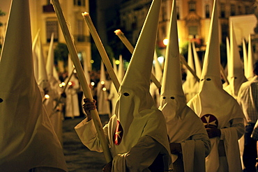 Nazarenos of the brotherhood La Borriquita during procession on Palm Sunday, Semana Santa, Sevilla, Andalusia, Spain, Europe