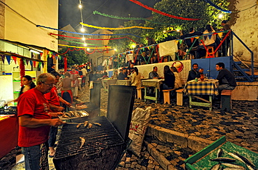 Street festival at Alfama quarter in the evening, Lisbon, Portugal, Europe