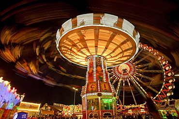 Swing carousel and ferris wheel at the Oktoberfest at night, Theresienwiese, Munich, Bavaria, Germany, Europe, Europe