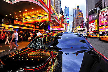 Reflection on the surface of black car, Times Square, Manhattan, New York City, USA