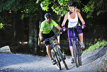 Two mountain bikers in a bike park, Hochries, Samerberg, Upper Bavaria, Germany