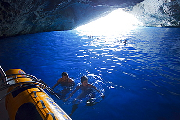 People swimming in the Blue Grotto, Cabrera island, Balearic Islands, Spain, Europe