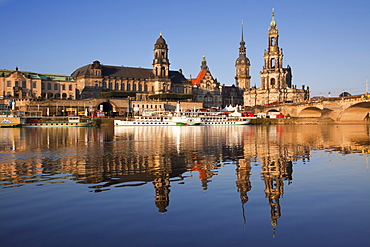 View over the Elbe river to Bruehlsche Terrasse, Staendehaus, Dresden castle and church Hofkirche in the evening light, Dresden, Saxonia, Germany