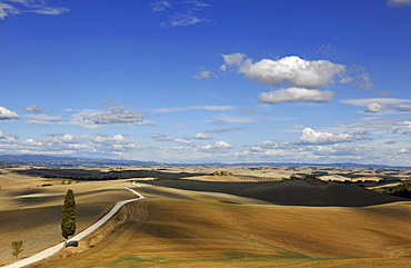 Hilly landscape under clouded sky, Crete, Tuscany, Italy, Europe