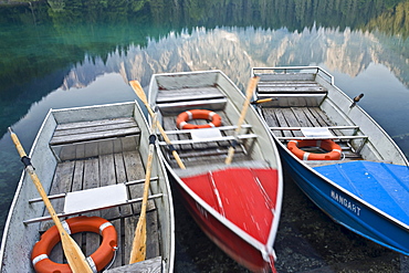 Rowing boats at the banks of Laghi di Fusine, Julian Alps, Italy, Europe