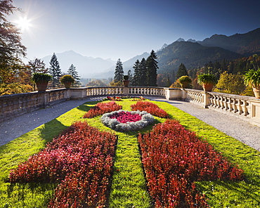 Flower beds in the garden with view of mountains, Linderhof castle, Bavaria, Germany, Europe