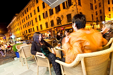 Ladies enjoying the evening in the Rex Lounge, old town, Cours Paoli, Corte, Corsica, France