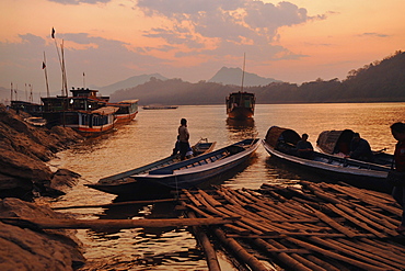 Boats at the banks of Mekong river, Luang Prabang after sunset, Laos