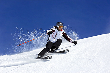 Skier going downhill, South Tyrol, Italy, Europe