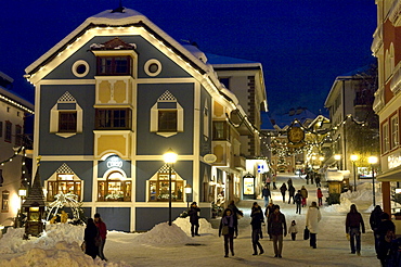 People in snowy street in the evening, Ortisei, Val Gardena, South Tyrol, Italy, Europe