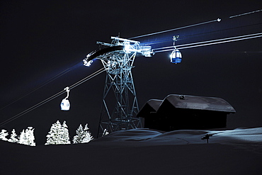 Illuminated cable car above ski slope at night, Alpe di Siusi, Valle Isarco, Alto Adige, South Tyrol, Italy, Europe