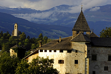 Medieval Proesels castle in front of overcast mountains, Voels am Schlern, South Tyrol, Alto Adige, Italy, Europe