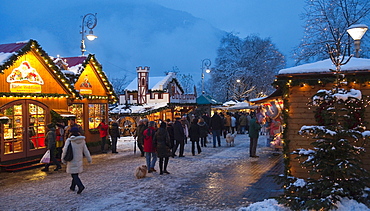 People at christmas market in the evening, Merano, Vinschgau, South Tyrol, Alto Adige, Italy, Europe