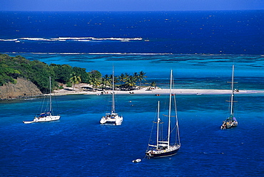 Sailing boats anchoring in a bay at Horseshoe Reef, Tobago Cays, St. Vincent, Grenadines, Caribbean, America