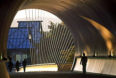 People walking over a bridge towards the Miho Museum, Shigaraki, Japan