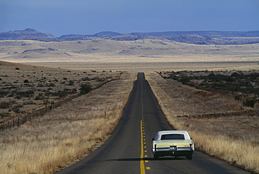 A lonesome car driving on the Highway, Davis Mountains, Texas, USA