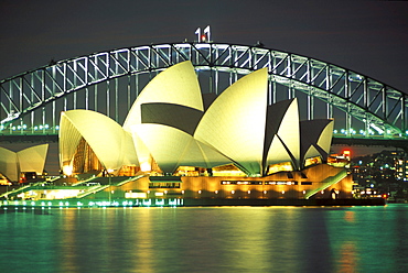 The illuminated Opera House and Harbour Bridge at night, Sydney, New South Wales, Australia