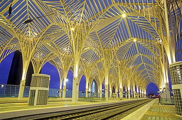 Illuminated, deserted railway station in the evening, Gare do Oriente, Parc de Nacoes, Lisbon, Portugal