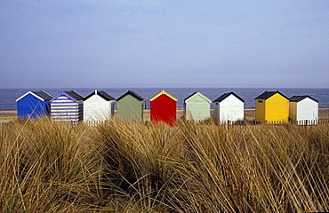 A line of colourful beach huts, Southwold, East Anglia, England