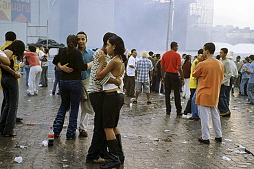 Teenagers dancing and standing on a square at Festas Juninas, Caruaru, Sao Juao, Brazil