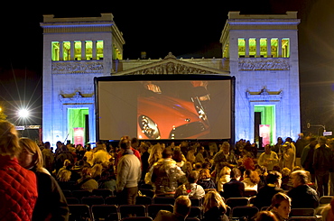 Spectators in front of the silver screen of an open air cinema, Koenigsplatz, Munich, Bavaria, Germany, Europe